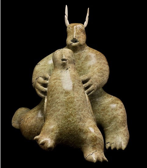 Nuyaliaq Qimirpik, Horned Spirit and Owl, 1968-70
17 x 15 1/2 x 17 in.
For a brief period of perhaps no more than three or four years (c. 1968-1971), a small group of carvers in Kimmirut, led by Nuyaliaq, created a remarkable and delightful group of spirit carvings, apparently at the request of a local schoolteacher named Tony Whitbourne who was buying carvings for the government for a short time. This spiritual flowering of art reminds us of a similar occurrence in nearby Cape Dorset in the early 1960s, but unfortunately in the case of Kimmirut art the florescence was not sustained – a sad loss for Inuit art.


Nuyaliaq’s Horned Spirit and Owl is a splendid example of the style. On the one hand the sculpture is poetic and haunting, on the other, it is incredibly charming. The horned figure might in fact be a transforming shaman; its overall posture and very human hands contrast with the bear-like body and bird-like head. The large figure holds its young owl companion almost as if presenting it as an offering or readying it for a spiritual journey. Both mouth and beak are agape in awe.


Today Nuyaliaq Qimirpik is best known as an accomplished carver of muskoxen. It is our pleasure to offer this sculpture by the artist as a work of profound spirituality and captivating beauty.


References: For other fine spirit sculptures by this artist see Bernadette Driscoll, Baffin Island, (Winnipeg Art Gallery, 1983) cat. 57, or Darlene Wight, The Swinton Collection of Inuit Art, (Winnipeg Art Gallery, 1987) cat. 134; Maria von Finckenstein ed., Celebrating Inuit Art 1948-1970, (Canadian Museum of Civilization, 1999) p. 129. A fine Spirit with Young from c. 1968 is illustrated in George Swinton, Sculpture of the Inuit, (McClelland & Stewart, 1972/92), fig. 517, p. 195. Three of Nuyaliaq’s spirit sculptures are illustrated in Maria von Finckenstein, “Four Works from Kimmirut” in Inuit Art Quarterly, (Vol. 14, No. 1, Spring 1999:40-41). 
03571-1