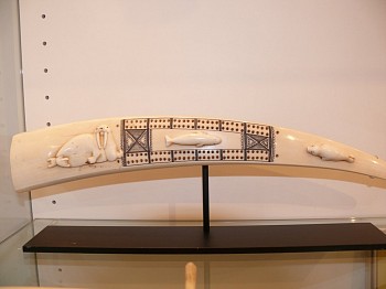 19th & 20th C Alaskan Anonymous -&nbsp;Cribbage board with walrus in relief; basking seal and whale are attached w glue