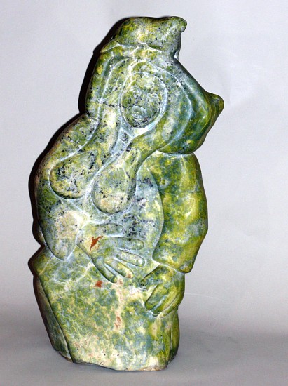 Qaqaq (Kaka) Ashoona, Female shaman with walrus helping spirit, Before 1973
25 x 13 x 5 in.
SOLD
This is an early work by Qaqaq (Kaka) Ashoona. The figure's bared teeth were a hallmark of early work by Qaqaq, a feature that appears in very few other artist's work.  The flowing braids and large hands prefigure his later works.  (See the Sedna by Qaqaq, whose hands, carved about 20 years later, are almost identical to those of this figure.)  In addition, the majestic woman has a small walrus -- a helping spirit -- perched on top of her head, telling us that she was a shaman. 

Qaqaq was a first-generation artist from Ikirasak, an outpost camp on South Baffin Island, NU who became based out of Kinngait (Cape Dorset), NU. Qaqaq maintained a traditional lifestyle on the land while simultaneously producing a substantial artistic legacy and though a prolific carver, Qaqaq self-identified as a hunter.  Preferring to remain away from town Qaqaq would travel seasonally to Kinngait to sell his carvings and would occasionally live in the community.
Qaqaq's method is notable in that he only ever used hand-carving tools to produce his pieces, expressing a fear of injuring himself with electric tools. The hallmark of his sculpture is the combination of heavy, compact and free flowing forms. Qaqaq stated that although human faces are harder to carve he was drawn to sculpting them more often than animals. 
 
Qaqaq's  work has exhibited nationally and internationally. In April of 1973 his first solo exhibition, Sculpture by Kaka of Cape Dorset was held at Gallery of the Arctic in Victoria, BC. His work is housed in numerous major collections including the National Gallery of Canada, Ottawa, ON Winnipeg Art Gallery, MusÃ©e des beaux-arts de MontrÃ©al and the Canadian Museum of History, Gatineau, QC.
03703-1