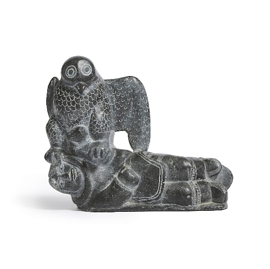 Davidialuk Alashua Amittu, Legend of the eagle who took the small girl to be his wife, c. 1965
Stone, 8 1/2 x 10 1/4 x 3 1/2 in. (21.6 x 26 x 8.9 cm)
Davidialuk wrote down the legend depicted by this sculpture, reproduced below:

Legend of the eagle who took a small girl to be his wife.

â€œThis is the story of three young girls who played at being wives. One made believe she was the wife of a killer whale, the second of an eagle and the third, of a stone.

The first girl was taken by a real whale to an island across the sea. He kept her there for many days as his wife. One day, while the whale slept, the girl spotted a boat in the distance. Excited, she cried aloud, "A boat! A boat!" She realised her mistake, however, when the whale wakened and asked: â€œWhat was that you saw?" She lied quickly, telling him that it was only a fox and a rabbit walking together and that he should go back to sleep. This time, she waited quietly until the boat drew near and she was able to signal to be picked up. Even though the whale wakened and gave chase, he was too late to recapture his wife. The girl believes that she was taken to be the wife of a whale because of the game she played with the bone of the whale and she has never played that game again.

The second girl was pretending to be the wife of an eagle, using a bone of the eagle. A real eagle took her away to a high cliff from which she could not escape. After several days, she conceived the idea of braiding a rope of sinew. The eagle was a good provider and she was never hungry nor short of sinew. It took her several days of braiding and the work was so strenuous that the flesh of her fingertips wore off, exposing the bone. The eagle had great pity for her, not suspecting the cause of her difficulty. Finally, the rope was long enough and her only problem now was that the eagle was never away long enough for her to climb down the cliff. To make sure he would be away longer than usual, she sent him to get her some caribou meat. She knew the caribou were far away. The eagle, who enjoyed pleasing his wife, left right away and the girl he had taken to be his wife climbed down the cliff and ran safely to her home. Like the first girl, she believed this had happened because she had been playing at being a wife with the bone of an eagle and she never played that game again.

The third girl was pretending to be the wife of a stone. Singing to herself, she climbed a mountain with a stone in her arms. As she climbed higher, her arms turned to stone but she kept on climbing and singing. She didn't stop singing even when her legs had turned to solid stone. Soon her whole body, even her head, turned into stone and she could no longer climb or sing. She stayed in the same spot forever. Playing the wife of a stone, she had turned into stone and there was nothing anyone could do to bring her back to life.â€
03564-1
