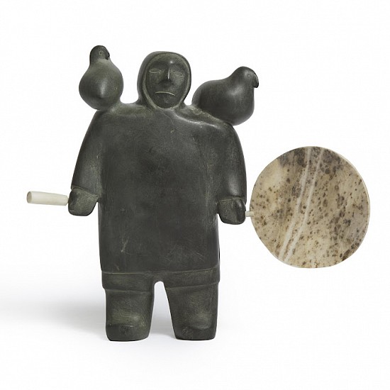 George Tataniq, Drum Dancer with Attendant Spirits, c. 1975
Stone, antler, 9 x 10 1/2 x 2 1/4 in. (22.9 x 26.7 x 5.7 cm)
SOLD A massive drum dancer has two helping spirits in the form of birds on his shoulders.
In the 1986 catalogue for the exhibition The Keewatin Spirit, author and collector Norman Zepp speaks of "a purity of line [in Tataniq's works] which elevates his sculpture beyond the purely descriptive. Both Tataniq's images of the empirically observable world and his images of the supernatural are characterised by a monumental weight, and as here, a purity of line, eye for plane and volume, and exceptional sure-footedness in his address of all three."

This sculpture is published in Harold Seidelman's and James Turner's 1993 text The Inuit Imagination: Arctic Myth and Sculpture.
A closely-related work to this sculpture was chosen for the cover of the 1992 revised and updated publication of George Swinton's classic reference work Sculpture of the Inuit. 
03563-1